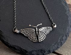 This antique style moth pendant necklace is made by using the ancient lost wax technique and is hand forged. It comes in a sterling silver chain of your choice and and the pendant is solid sterling silver. A beautiful, necklace that will add a special style to any look. Ideal as a gift to yourself or someone special.  The total length of the chain is 460mm, please contact me if you would like me to custom made the length of your chain. The pendant measures 50mm x 28mm. All my pieces are high qua Vintage Handmade Butterfly Necklace, Vintage Silver Necklace With Butterfly Charm, Handmade Silver Butterfly Necklace, Bohemian Butterfly Sterling Silver Necklace, Bohemian Sterling Silver Butterfly Necklace, Unique Handmade Silver Butterfly Necklace, Antique Silver Butterfly Jewelry, Nickel-free Victorian Sterling Silver Necklaces, Victorian Sterling Silver Nickel-free Necklace