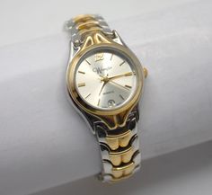 "Vintage Wrangler wristwatch. Polished chrome and gold tone finish case and band. Segmented bracelet style band with clip clasp. Siver analog dial with calendar day display.  Quality quartz movement made in Japan.   Excellent condition and working great with a new battery installed. 6 1/2\" long 1\" dial Your watch will be shipped safely in a custom gift box suitable for presentation.  Deck Vintage strives on being a source for authentic vintage and historic items in the best condition possible. Any flaws or wear will be visible in photos, any significant or hard to see flaws will be mentioned in description. All watches are cleaned, serviced when needed, fully tested and shipped with new battery installed.. Feel free to message me for any questions you may have, I'm easy to talk to. Altho Vintage Wrangler, Custom Gift Boxes, Analog Watch, Women Wrist Watch, Quartz Movement, Fashion Bracelets, Polished Chrome, Womens Watches, Customized Gifts