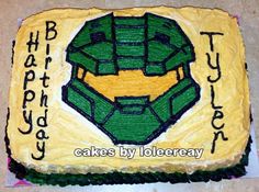 a birthday cake that is shaped like a green lantern