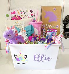 a unicorn themed gift basket with personalized items for the child's birthday party