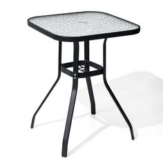 an outdoor table with black metal legs and white mosaic tile on the top, against a white background