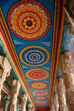 the ceiling is painted with many colors and designs