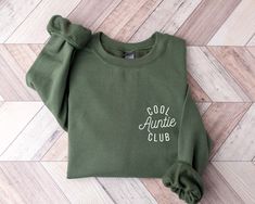 "Cool Aunties Club Sweatshirt and Hoodie, Cool Aunt Sweatshirt, Aunt Gift, Aunt Birthday Gift, Sister Gift, Auntie Sweatshirt,Aunt Sweatshirt This shirt has a hand pressed design. It has a very soft touch that you will feel comfortable for a long day. HOW TO ORDER ** Check and Review all Photos. ** Select your item's Size and Color from drop down menus. ** Choose the Quantity you want. ** Provide personalization in personalization box if offered.(name, print color etc.) ** Click ADD TO CART. And, you can go back to add more product color for your family members or you can complete the checkout process. ** Please Click \"Proceed to Check Out\" ** Finally, Your order will be ready to ship 1 - 3 Business Day. Due to the nature of the fabric as well as your monitor or mobile screen colors may Casual Long Sleeve Birthday Sweatshirt, Casual Cotton Hoodie For Birthday, Casual Winter Birthday Sweatshirt, Long Sleeve Winter Birthday Sweatshirt, Casual Winter Birthday Tops, Winter Birthday Sweatshirt With Letter Print, Cotton Sweatshirt For Birthday In Winter, Cotton Sweatshirt For Winter Birthday, Auntie Sweatshirt