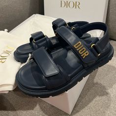 Brand New In Box. With Dust Bags. Size 37 Dior Dioract “Dad Sandals” In Navy Blue Awesome Opportunity At Under Retail Price!!! Gold Hardware Logos Adjustable Velcro Straps Genuine Leather Note Dust Bags Have A Little Dirtiness Dad Sandals, Uniqlo Bags, Vintage Chanel Handbags, Dior Sandals, Bow Sandals, Swim Shoes, Dior Shoes, White Sandals, Leather Logo