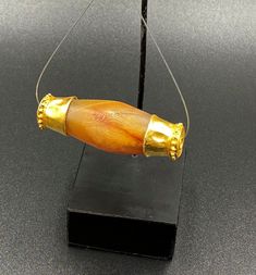 The Beautiful Agate Bead Wrapped In Gold Probably From Ancient Historic Cultures Civilizations Of Central Asian Area Bactrian Regions. Size Details Pictures Are Listed Above. Good Conditions As Shown In The Pictures. Quite Big Size Bead. We Provide Fast And Free Shipping Service World Wide To Our Customers .We Ship Mostly Via Fedex And DHL. If You Have Any Questions Please Feel Free To Send Us Message. Amulet Jewelry With Polished Oval Beads, Spiritual Gold Gemstone Beads, Large Beads Amulet Jewelry For Rituals, Gold Agate Beads For Jewelry Making, Traditional Gold Agate Beaded Necklaces, Handmade Gold Amulet Beads, Handmade Gold Beads For Amulets, Amulet Style Large Beads For Gifts, Artisan Gold Beads, Gems, And Cabochons