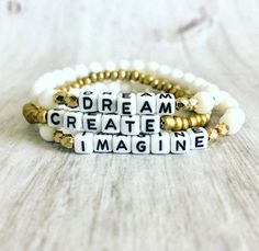 "Word Affirmation bracelet Sets accented with Letter Beads Dream Create Imagine Materials: multi size cream white glass beads, acrylic letter beads 3 Piece Set Stackable Bracelet sets Stretch Bracelet approximately 6.75\" length Made of very resilient clear cording Please visit my shop for more listings at www.fernhomeandfashion.etsy.com" Inspirational Adjustable White Name Bracelet, Inspirational White Adjustable Name Bracelet, Inspirational White Name Bracelet With Letter Beads, Inspirational White Bracelet With 8mm Beads, Inspirational White Name Bracelet With Round Beads, White Inspirational Stretch Bracelet With 8mm Beads, Inspirational White Bracelet Jewelry, Inspirational White Name Bracelet, Inspirational White Round Bead Jewelry