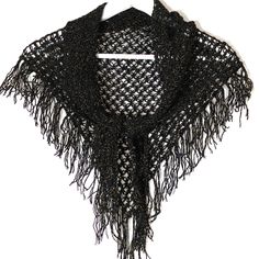 "This vintage hand crochet shawl is triangular and has a fringe of tassels to two sides. It is beautifully hand crafted from black yarn with sparkly gold thread throughout the whole garment and in the fringe of glittery tassels.  It is a small and beautiful vintage black and gold hand crochet shawl that will brighten up any outfit, day or night. Ideal as a shoulder wrap to keep warm in cool summer evenings and the glittery wrap will add sparkle to your outfit on an evening out in a restaurant or Sparkly Scarf, Gold Crochet, Vintage Shawl, Bohemian Wrap, Vintage Shawls, Shoulder Wrap, Crochet Vintage, Wool Wash, Gold Hand