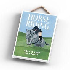 a horse riding poster hanging on a wall