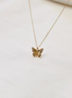 Delicate and sweet, this cubic zirconia butterfly necklace is a larger version to our Miniature CZ Butterfly Necklace . Butterflies symbolize transformation and hope which will make this a beautiful addition to your collection Materials: gold plate with cubic zirconia details Length: 18" gold chain SKU: CN1467G Materials+Care Luxury Yellow Gold Butterfly Necklace Dainty, Small Butterfly Necklace, Butterfly Neckless, Butterflies Symbolize, Gold Butterfly Necklace, Butterfly Necklace Gold, Fancy Jewelry Necklace, Butterfly Jewelry, Fancy Jewelry