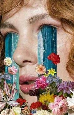 a woman with flowers painted on her face