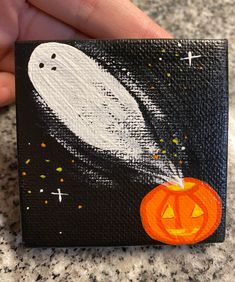 Ghosts with pumpkin, mini canvas painting. Hand drawn and painted on 2.5x2.5 canvas. Mini easel is included with painting. Each painting is made to order and may vary slightly. Sprayed with a glossy sealant. Painting On Mini Pumpkins, How To Paint A Pumpkin, Halloween Canvases, September Painting, Ghost Painting Ideas, Pumpkin Canvas Painting, Painting Ideas Halloween, Halloween Canvas Paintings, Halloween Canvas Art