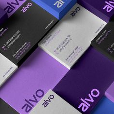 several business cards stacked on top of each other in purple and blue colors with the words ows above them