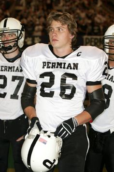 two football players standing next to each other