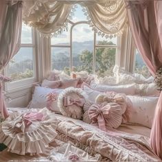 a bed with pink ruffles and pillows on it in front of a window