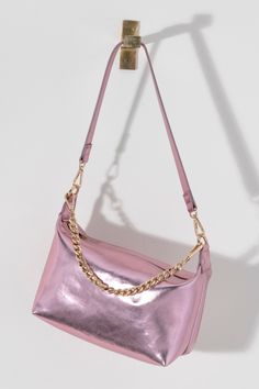 Make a statement this summer with Shiraleah's Maddie Shoulder Bag. Made from metallic PU, this shiny handbag is sure to turn heads. Add some versatility to your style by wearing with the detachable single shoulder strap or with the chic chain handle. Pair with other Shiraleah items to complete your look! Chic Silver Shoulder Bag With Detachable Strap, Metallic Rectangular Shoulder Bag With Chain Strap, Trendy Shoulder Bag With Metal Hardware For Party, Chic Metallic Shoulder Bag With Adjustable Strap, Chic Metallic Bags For Everyday Use, Chic Metallic Shopping Bags, Metallic Shoulder Bag For Evening With Zipper, Trendy Metallic Shoulder Bag For Evening, Chic Metallic Everyday Bag