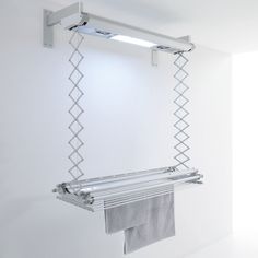 a towel rack hanging from the side of a wall