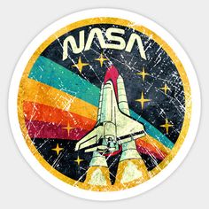 an nasa sticker with the space shuttle on it