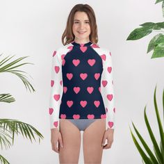 Get a colorful and soft rash guard that's the right fit for any active teen who loves water and contact sports. Its longer body and sleeves will protect the skin, while the fitted design means it won't get in the way even during the most intense activities. * 82% polyester, 18% spandex * 6.78 oz/yd² (230g/m weight may vary by 5% * UPF 50+ * Very soft four-way stretch fabric that stretches and recovers on the cross and lengthwise grains * Fitted design * Comfortable longer body and sleeves * Overlock, flat seam, and cover stitch * Blank product components sourced from China Karen Black, Rash Guard, The Cross, Kids Tops, Upf 50, Stretch Fabric, Gender Neutral, Bathing Beauties, Kids Outfits