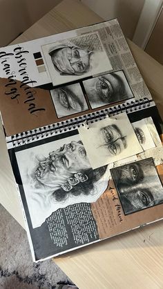 an open book with drawings on it sitting on a table