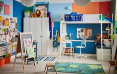 a child's room with colorful walls and furniture, including bookshelves, desks, and shelves