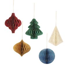 three paper christmas ornaments hanging from strings