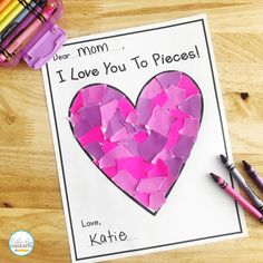 a mother's day card with pink paper and crayons next to it