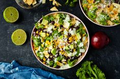 two bowls filled with mexican salad next to limes