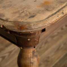 an old wooden table with peeling paint on it