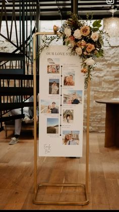 a sign with pictures and flowers on it in front of a table at a wedding