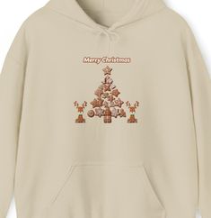 Welcome to my Etsy Shop: Introducing our Gingerbread Design Hoodie, a cozy and stylish addition to your winter wardrobe and for the Christmas Season Crafted with care from a medium-heavy fabric (8.0 oz/yd² or 271 g/m this hoodie strikes the perfect balance between warmth and comfort. The blend of 50% cotton and 50% polyester ensures a soft, cozy feel that will keep you snug during chilly days. Designed with your comfort in mind, the classic fit of this hoodie, coupled with the convenient pouch p Casual Christmas Hoodie With Crew Neck, Casual Christmas Cotton Hoodie, Casual Cotton Christmas Hoodie, Casual Holiday Hoodie With Crew Neck, Casual Crew Neck Hoodie For Holiday, Casual Winter Hoodie For Holidays, Casual Winter Holiday Hoodie, Gingerbread Design, Gingerbread Tree