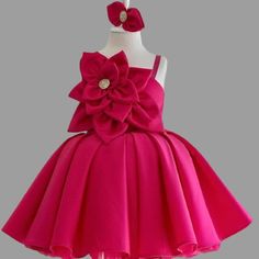 Dress your little one in festive charm with our Christmas Red Satin Baby Girl Dress. This cute party dress is crafted for joyful celebrations, making it an ideal choice for Christmas parties, birthday celebrations, and delightful photoshoots. The luxurious red satin and charming design promise to make every moment merry and bright. Features: Vibrant Christmas red satin for a festive look. Adorable and cute party dress for baby girls. Light and comfortable for all-day wear. Ideal for birthday par Holiday Princess Dress With Bow, Pink Princess Christmas Dress, Elegant Sleeveless Tutu Dress For Festive Occasions, Christmas Princess Dress In Pink, Christmas Princess Dress With Bow, Red Princess Dress With Bow For Dress-up, Sleeveless Christmas Dress With Bow, Christmas Wedding Princess Dress With Bow, Elegant Sleeveless Princess Dress For Festive Occasions