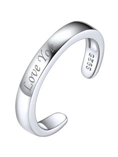 a white gold ring with the words love story engraved on it