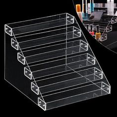 clear acrylic display case for cosmetics and beauty products with dividers on each side