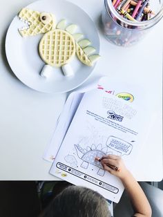 a child is doing crafts with waffles and crayons