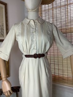 Vintage beige Jonathan Logan button up and side zip shirt dress, xs. My dress form is a size 2 and the side zip would not go up all the way, dress is xs and a petite fit. Belt is not original to the dress but is included. In good vintage condition and lined, just a tiny repair at back pleat between shoulder blades, not very noticeable and shown in photos. Please check measurements.  Measurements taken with garment lying flat, double for full size  Bust pit to pit 18.5 inches with room in the bust  Waist 12 inches  Hips 18 inches Length 34 inches Sleeve from shoulder to sleeve edge 12.5 inches  Please keep in mind that vintage items are often times many decades old, I disclose flaws as best I can and inspect my items closely. I do not accept returns. If you find I misrepresented an item sig Jonathan Logan, Belted Shirt Dress, Dress Form, I Dress, Labour Day, Shirt Dress, Dress Outfits, Bathing Beauties, Womens Dresses