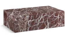 a red and white marble block on a white background