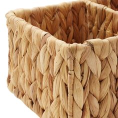 a close up of a woven basket on a white background