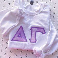 This trendy, unique, handcrafted Pink & Purple Cloud Gildan Greek Letter Crewneck Sweatshirt is sure to stand out on any campus! Grab one for you, your big/little, or a group of sisters (bulk discount information can be found below). If you need some greek letter sweatshirt inspiration, please visit the inspiration page! Picture Details Pictures: ⭑ #1-4: White sweatshirt, Light Purple background fabric Care Instructions ⭑ Wash inside out on cold & air dry for best results ⭑ Do not dry cl Sweatshirt Inspiration, Greek Letter Shirts, Light Purple Background, Letter Sweatshirt, Big Little Gifts, Gildan Hoodie, Fabric Letters, Womens Sweatshirts, Background Fabric