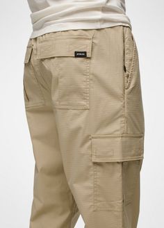 Utility-inspired cargo pants made with durable cotton ripstop and plenty of pockets for on-the-go storage. Beige Cargo Pants With Side Pockets For Outdoor Activities, Beige Utility Cargo Shorts With Cargo Pockets, Cotton Parachute Pants With Patch Pockets For Outdoor, Beige Outdoor Bottoms With Multiple Pockets, Beige Outdoor Pants With Side Pockets, Urban Cargo Pants With Patch Pockets For Outdoor, Khaki Parachute Pants With Patch Pockets For Outdoor, Beige Outdoor Cargo Pants With Patch Pockets, Functional Cargo Jeans With Side Pockets