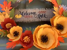 a welcome fall wreath with paper flowers