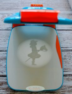 the shadow of a child's toy is placed in an empty bowl on a wooden table