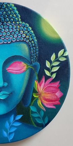 a painting of a buddha face with flowers on it