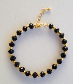 Black and gold crystal bracelet pulseira de cristal preto e dourado Gold Crystal Bracelet, Gold And Black Bracelet, Black Crystal Bracelet, Black Beads Bracelet Gold For Kids, Black And Gold Beaded Bracelets, Handmade Bracelets Ideas Beads, Black Beads Bracelet Gold, Black Beads Bracelet, Black Gold Bracelet