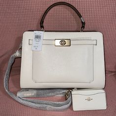 Brand New With Tags, Never Been Used White With Brown Interior And Side Parts Matching Zipper Wallet Sold As Bundle. White Satchel Bag For Work, White Satchel For Work, White Top Handle Bag For Work, Chic Cream Bag With Interior Card Slots, White Bags With Removable Pouch For Work, White Work Bags With Detachable Strap, White Elegant Bags For Work, Elegant White Bags For Work, White Shoulder Bag With Detachable Handle For Work