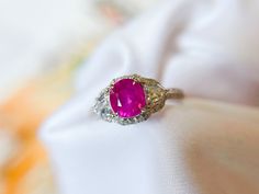 This ring sets in a 3-stone style that features a rare and beautiful natural hot pink sapphire from Mogok of Myanmar.   The color and luster of the gemstone make this hot pink sapphire so lively and unique.  The design is simply classic and one-of-a-kind.  It is a perfect gift for Weddings, Mother's Day, Birthdays, Valentine's Day, Graduation, Christmas, or just about any other occasion.  ◆ GEMSTONE: Natural Pink Sapphire, Diamond, Moissanites ◆ COLOR: Hot Pink ◆ ORIGIN: Mogok ◆ PINK SAPPHIRE WE Heirloom Ruby Ring With Three Stones, Heirloom Ruby Three Stone Ring, Hot Pink Engagement Ring, Fine Jewelry Ruby Three Stone Ring For Wedding, Fine Jewelry Three Stone Ruby Ring For Wedding, Pink Three Stone Jewelry For Anniversary, Pink Ruby Ring With Rose Cut Diamonds, Pink Ruby Ring With Rose Cut Diamonds For Wedding, Luxury Three Stone Ruby Ring For Wedding