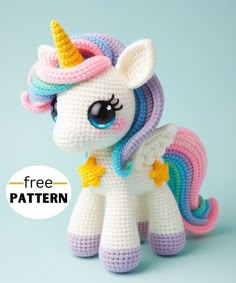 a crocheted unicorn with a rainbow mane and stars on it's head