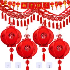 three red lanterns with chinese writing on them