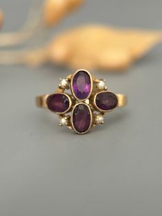 Size: 7.5US Weight: 2.4g Hallmarks: SMCO 10K I love love love wearing this low profile gold and amethyst ring. It coveres the finger nicely and has a very grand feel.  Great vintage condition, the stones are free of cracks and chips.  Patina as found. Expanded shop policies under FAQ Amethyst Ring, Pearl Ring, Shop Policies, Rings Statement, Pretty Things, Low Profile, Antique Jewelry, Favorite Jewelry, Statement Rings