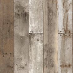 an image of wood planks that are painted in different colors and sizes on the wall