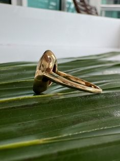 Vintage 10k Bezel Carved Natural Shell Cameo Ring Description: This vintage 10k ring features a carved natural shell cameo set in a bezel, adding a unique touch to your collection. Sized at 8 and weighing 4.31g, the shell's unique tone makes this ring a standout piece. As with all our pieces, this ring is a rare find—once it's gone, it's gone. Choosing this piece helps you stand out from the crowd while supporting sustainable practices. Why You'll Love It: Unique Design: The carved shell cameo a Antique Dome Ring Stamped 14k As Gift, Gold Dome Cabochon Ring In 14k Gold, 14k Yellow Gold Dome Ring With Oval Cabochon, Gold Oval Dome Ring With Cabochon, 14k Gold Dome Ring With Cabochon, Heirloom 14k Gold Dome Ring With Gemstone, Heirloom Style Gold Opal Ring With Bezel Setting, Heirloom Gold Dome Ring With Cabochon, Heirloom Gold Opal Ring With Bezel Setting